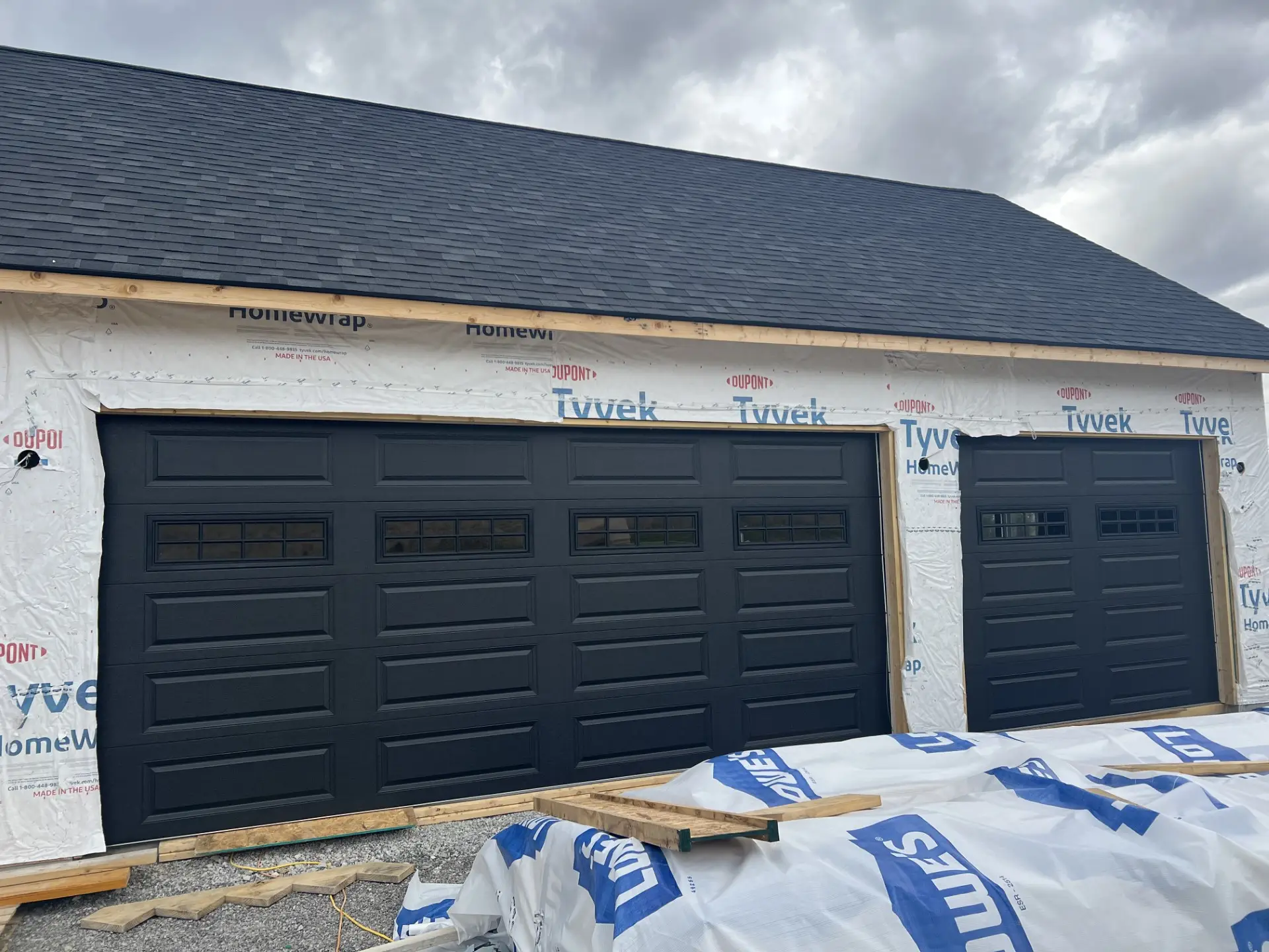 In the process of installing a double and single bay garage door in a new home in Crossville, TN.